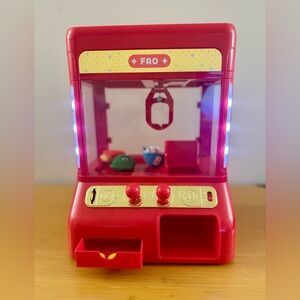 FAO Schwarz Toy Claw Machine with 3 plushies.